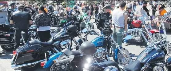  ?? PHOTOS: DON MORBERG ?? Calgary’s Two Wheel Sunday street fair has grown so large it needed a new location, moving to 5th Street NE where there’s more room to park all those motorcycle­s.