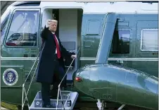  ?? ALEX BRANDON — THE ASSOCIATED PRESS ?? President Donald Trump gestures as he boards Marine One on the South Lawn of the White House, Wednesday, Jan. 20, 2021, in Washington. Trump is en route to his Mar-aLago Florida Resort.