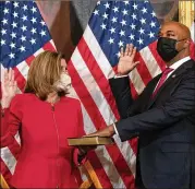  ?? JACQUELYN MARTIN/ AP ?? House Speaker Nancy Pelosi, D- Calif., holds a ceremonial swearing- in Thursday of Rep. Kwanza Hall, D- Ga., on Capitol Hill in Washington, a little before his first vote as a member of Congress. Hall will serve the remaining term of the late Rep. John Lewis.