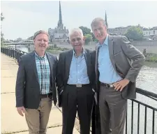  ?? DAVID HASKELL ?? People's Party Cambridge candidate David Haskell, left, poses with author Salim Mansur, middle, and party leader Maxime Bernier, right, during a private party rally in a home in Cambridge last month.