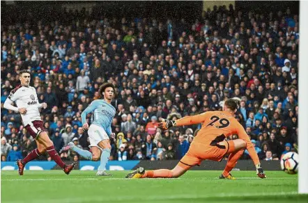  ?? — AFP ?? In-Sane: Manchester City’s Leroy Sane scoring his team’s third goal.