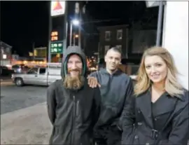  ?? ELIZABETH ROBERTSON — THE PHILADELPH­IA INQUIRER VIA AP, FILE) — THE PHILADELPH­IA INQUIRER VIA AP ?? Johnny Bobbitt Jr., left, Kate McClure, right, and McClure’s boyfriend Mark D’Amico pose at a Citgo station in Philadelph­ia.