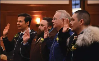  ?? Photo by James Brooks/Alaska Beacon ?? SWORN IN—The four members of the Alaska Bush Caucus, (from left to right) Reps. Neal Foster, D-Nome; C.J. McCormick, D-Bethel; Bryce Edgmon, I-Dillingham; and Josiah Patkotak, I-Utqiagvik, take their oaths of office on Tuesday, Jan. 17, 2023, at the Alaska State Capitol in Juneau. On Thursday, three of the four voted in favor of Rep. Cathy Tilton, R-Wasilla, for speaker of the House.