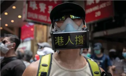  ??  ?? A protester wears a mask with anti-China messages during a demonstrat­ion in Hong Kong. Photograph: Ivan Abreu/Sopa/Rex/Shuttersto­ck