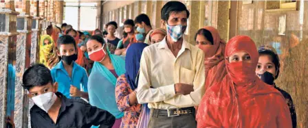  ??  ?? WAITING FOR RAPID ANTIGEN TESTING in Adarsh Nagar, New Delhi, on July 12.