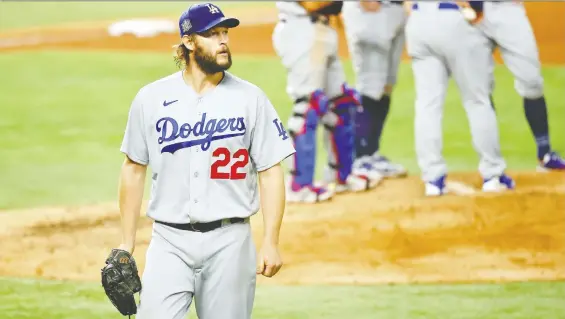  ?? KEVIN JAIRaJ/ USA TODAY ?? Dodgers ace Clayton Kershaw didn't have his best stuff on Sunday, but he battled into the sixth inning of a 4-2 win over Tampa Bay. Los Angeles leads the series 3-2.