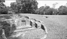  ??  ?? Putting near an old grave at the Fanling golf course can be a scary experience.