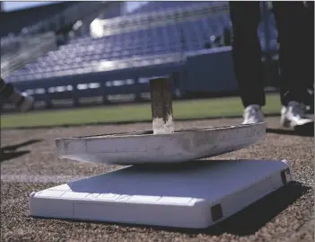  ?? BRYNN ANDERSON/AP ?? THE NEW, LARGER BASE SITS ON TOP OF THE OLDER, SMALLER BASE AT TD BALLPARK ON FEB. 15, 2023, IN DUNEDIN, FLA.