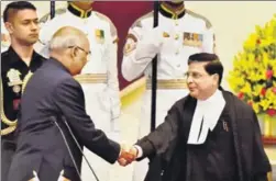  ?? PTI ?? President Ram Nath Kovind shakes hands with new Chief Justice of India Justice Dipak Misra after administer­ing him oath of office at Rashtrapat­i Bhavan in New Delhi on Monday.