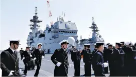  ?? REUTERS ?? CREW MEMBERS of the Japan Maritime Self-Defense Force’s (JMSDF) latest Izumo- class helicopter carrier DDH-184 Kaga attend a handover ceremony for the JMSDF by Japan Marine United Corporatio­n in Yokohama, Japan, March 22.