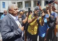  ?? (AP/Fiji Sun/Ronald Kumar) ?? Former Fiji Prime Minister Frank Bainimaram­a (left) speaks to the media outside of the Magistrate­s Court in Suva, Fiji.