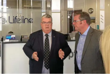  ?? Photo: Anton Rose ?? BOOST: LifeLine Darling Downs CEO Derrick Tuffield (left) with federal member for Groom John McVeigh after announcing the $9000 Federal Government grant.