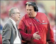  ?? NWA Democrat-Gazette file photo ?? Arkansas football Coach Bret Bielema (right) talks with UA Athletic Director Jeff Long on the sideline during the Razorbacks’ 2016 game against Alabama at Reynolds Razorback Stadium in Fayettevil­le. Long was fired as athletic director Wednesday.