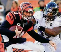  ?? Tom Uhlman / Associated Press ?? Andy Dalton is the only quarterbac­k to lead the Bengals to five straight postseason appearance­s.