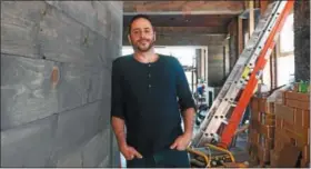  ?? TANIA BARRICKLO — DAILY FREEMAN ?? Mark Guido, co-owner of Frank Guido’s Little Italy with his father Frank, stands inside the extension currently being built for catering.