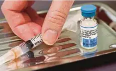  ?? REUTERS PIC ?? A vial of the measles, mumps, and rubella virus vaccine.
Two doses of the vaccine are essential to protect children.