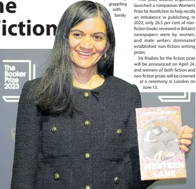  ?? AP ?? British author Chetna Maroo poses with her book ‘Western Lane’.