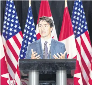  ?? CP PHOTO ?? Prime Minister Justin Trudeau speaks to reporters at the National Governor’s Associatio­n Special Session – Collaborat­ing to Create Tomorrow’s Global Economy in Providence, R.I.