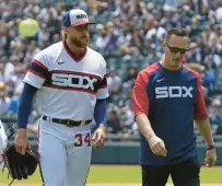  ?? NAM Y. HUH/AP ?? Michael Kopech, front left, walks to the dugout with a team trainer after being injured during the first inning.