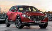  ?? THOMAS WIELECKI ?? Top compact/small SUV: Somehow the CX-30 slips in between the CX-3 and CX-5. Don’t ask us how, but it does it well.