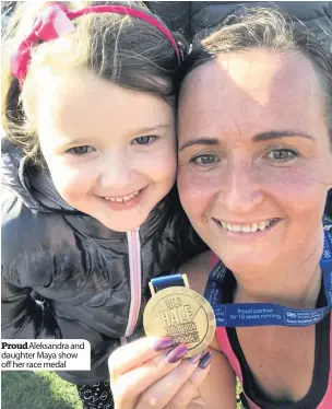  ??  ?? Proud Aleksandra and daughter Maya show off her race medal