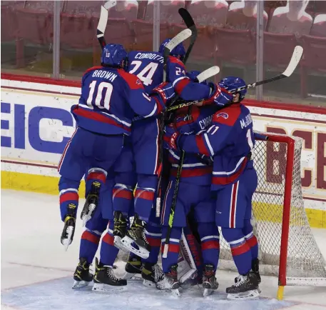  ?? PHoTos couRTesy of RicH gagnon / uMass lowell ?? THRILLER: UMass Lowell celebrates after upsetting top-ranked Boston College in the Hockey East semifinals at Kelley Rink on Wednesday night in Chestnut Hill. Below, UMass Lowell goalie Henry Welsch makes a save.