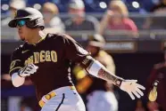  ?? Steph Chambers/Getty Images ?? Manny Machado was the first to commit a pitch clock violation, but the Padres star singled anyway.