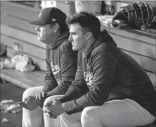  ?? Robert Gauthier Los Angeles Times ?? WALKER BUEHLER sits with Dodgers pitching coach Rick Honeycutt after throwing five scoreless innings against the Miami Marlins on Monday in his first major league start.