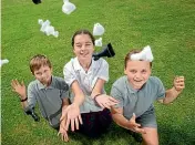  ??  ?? Oscar, Amber and Charlie enjoy juggling chess with their school work and free time.