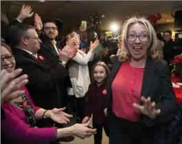  ?? JUSTIN TANG, THE CANADIAN PRESS ?? Liberal candidate Mona Fortier greets supporters after winning the Ottawa-Vanier federal byelection in Ottawa on Monday.