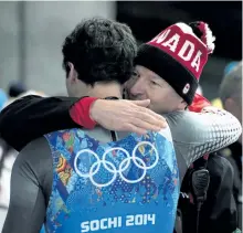  ?? JONATHAN HAYWARD/THE CANADIAN PRESS ?? Canada’s Sam Edney, left, is consoled following his team’s fourth-lace finish in the Luge Team Relay at the Sochi Winter Olympics, in Krasnaya Polyana, Russia, Thursday, Feb. 13, 2014. Canada’s luge relay team is set to gain a bronze medal from the...