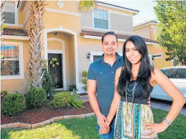  ?? TAIMY ALVAREZ/STAFF PHOTOGRAPH­ER ?? Ashraf Abualsuod and his wife, Samar Abdel-Jabbar, were able to get a mortgage on their Coral Springs home even though they only put down 5%. Ashraf and Samra are grateful they got a loan at 3.875 percent.