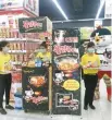  ?? Courtesy of Samyang Foods ?? In this photo provided by Samyang Foods, models promote Buldak Ramen at a supermarke­t in Vietnam.