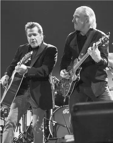  ?? Karl Walter, Getty Imag es ?? Musician Glenn Frey, left, with fellow Eagle Joe Walsh, has released a solo album.