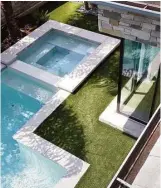  ??  ?? The backyard pool is surrounded by alwaysperf­ect artificial turf.