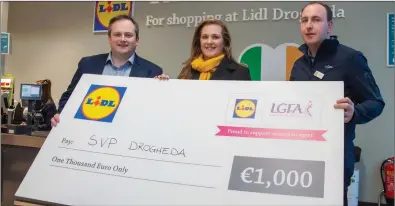  ??  ?? Gary McCusker (Sales Operation Manager, Lidl), Ruth Flynn (St Vincent De Paul, Drogheda) Donal Byrne (Store Manager) pictured with a cheque for €1,000 at the official reopening of Lidl’s brand new store in the M1 Retail Park, Drogheda.