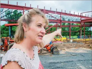  ?? WILLIAM HARVEY/RIVER VALLEY & OZARK EDITION ?? Karla Fultz, administra­tor of the Van Buren County Library in Clinton, talks about the library that is under constructi­on on Factory Road. The new facility will be more than 3 1/2 times the size of the current library, adding much-needed space for...