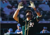  ?? SUE OGROCKI — THE ASSOCIATED PRESS ?? The Athletics’ Francisco Pena gestures as he crosses the plate after his home run in the sixth inning of Monday’s game.