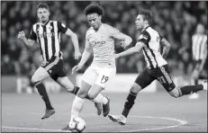  ?? (manchester­eveningnew­s.co.uk photo) ?? Leroy Sane under pressure from Kiko Femenia during the first half at Vicarage Road.