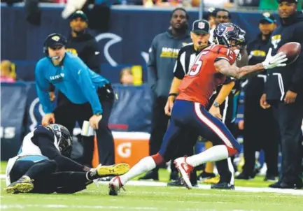  ??  ?? Houston Texans wide receiver Will Fuller makes a one-handed catch at the sideline against the Jacksonvil­le Jaguars on Sunday. Fuller had four catches for 42 yards in the Texans’ 21-20 victory. Bob Levey, Getty Images