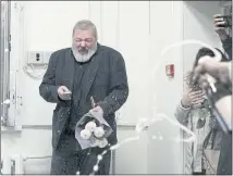  ?? ALEXANDER ZEMLIANICH­ENKO — THE ASSOCIATED PRESS ?? Colleagues spray Champagne on Novaya Gazeta editor Dmitry Muratov at the newspaper office in Moscow on Friday after he was named a Nobel Peace Prize recipient.