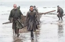  ?? HBO ?? Davos (Liam Cunningham) and Jon (Kit Harington) arrive at Dragonston­e after a seemingly uneventful trip on Thrones.