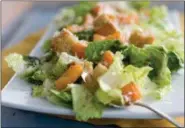  ?? MATTHEW MEAD — ASSOCIATED PRESS FILE ?? A 2012 photo photo shows a Caesar salad with romaine lettuce. Food regulators are urging Americans not to eat any romaine lettuce because of a new food poisoning outbreak.
