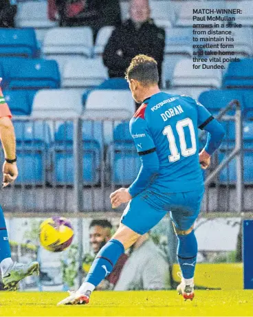  ?? ?? MATCH-WINNER: Paul Mcmullan arrows in a strike from distance to maintain his excellent form and take home three vital points for Dundee.