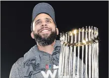  ?? HARRY HOW
GETTY IMAGES ?? Red Sox pitcher David Price celebrates with the World Series trophy.