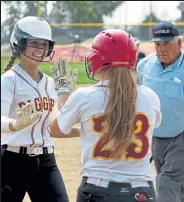  ?? Paul Dineen / OTSPORTSCH­EK ?? Kylei Abreo high fives teammate Kealy Langford as she crosses home plate in a home game against University on Sept. 19, 2020.