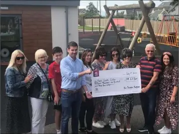  ??  ?? Members of the McNally family present a cheque to the Maria Goretti Children’s Respite Centre.