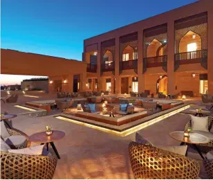  ??  ?? QUIETLY OPULENT: A courtyard, above, at the mountainto­p Anantara Al Jabal Al Akhdar Resort, top, where vultures soar