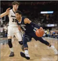  ?? GRETCHEN ERTL — THE ASSOCIATED PRESS ?? Villanova guard Josh Hart (3) drives the ball past Providence guard Ryan Fazekas (35) during an NCAA basketball game, Saturday in Providence.