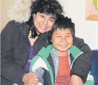  ?? ANNA BANERJI ?? Anna Banerji and her son Nathan visit Nathan’s birth home community of Clyde River in 2013. He died by suicide in 2018.